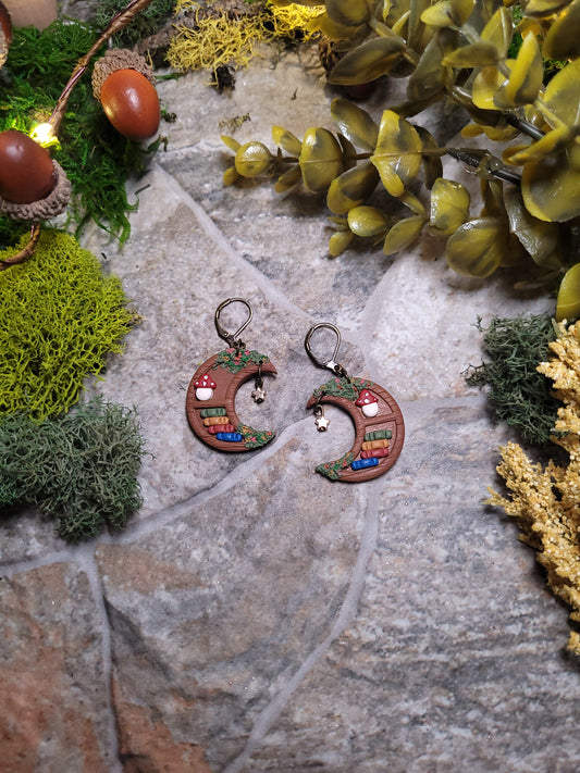 moon bookshelf on stone background surrounded by foliage.