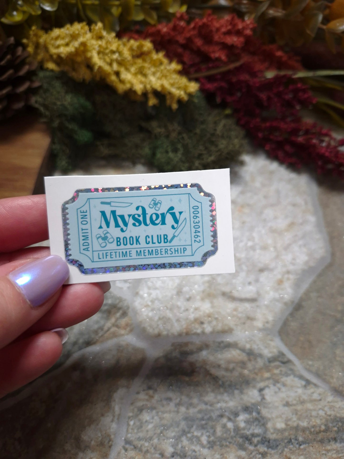 Mystery Book Genre Sticker on a stone background