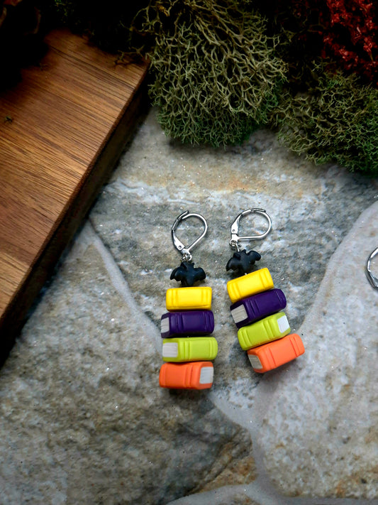 Close up of regular Bat bookstack on a stone and wood background surrounded by foliage