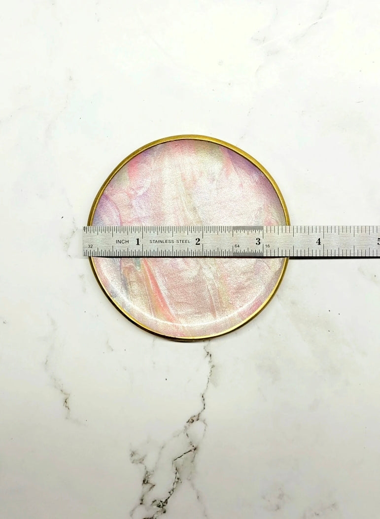 Mother of Pearl trinket dish on a marble background with a ruler to show size