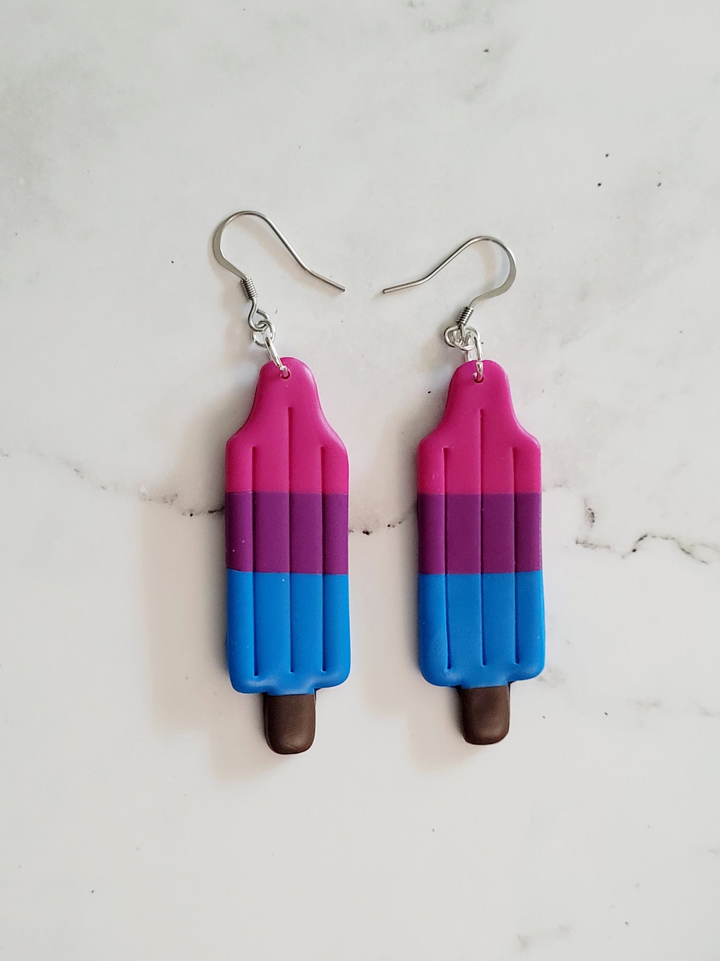 Closeup of the Bi Pride Flag Bomb Pop Earrings