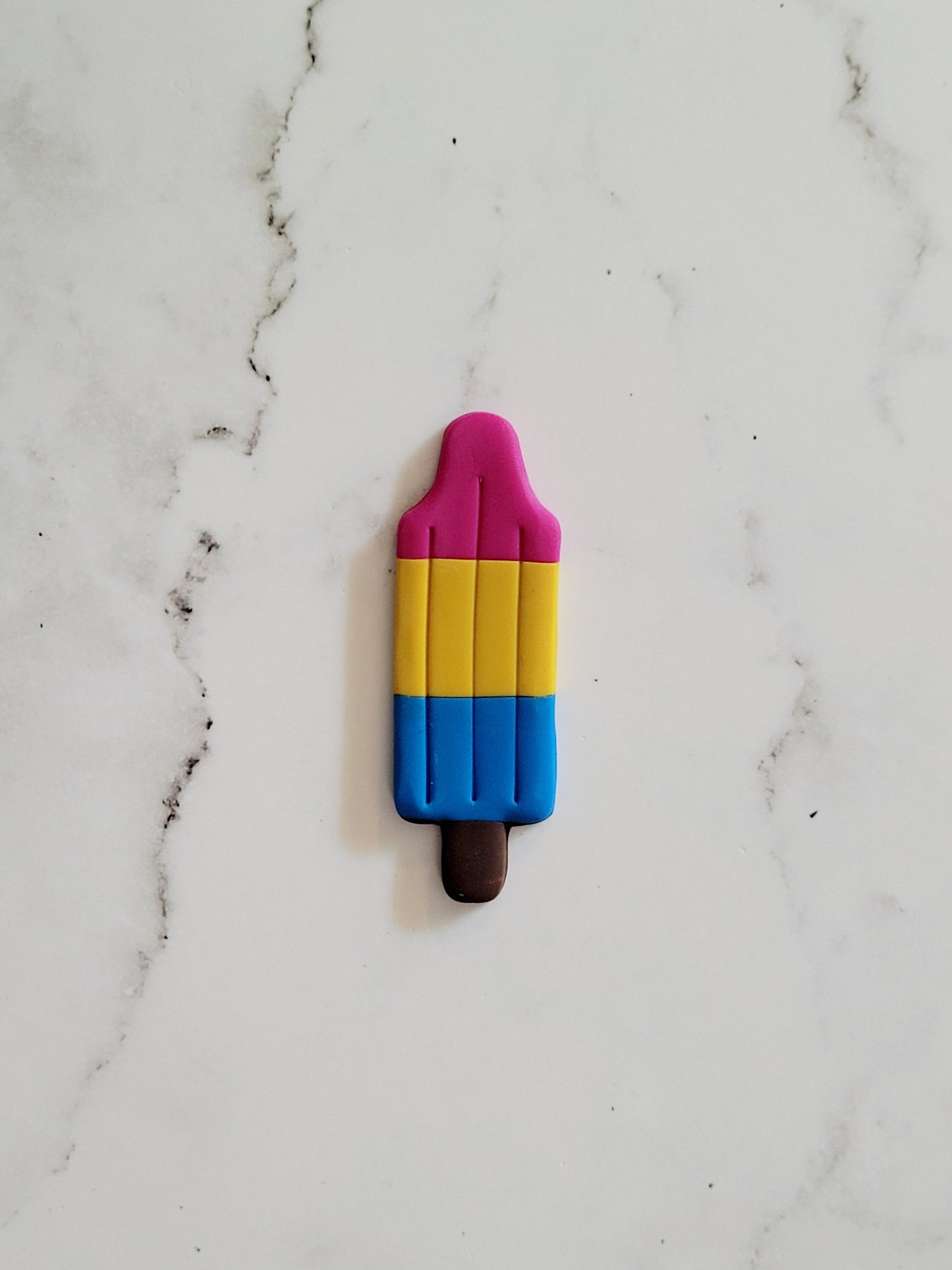 Closeup of the Pan Pride Flag Bomb Pop Pin
