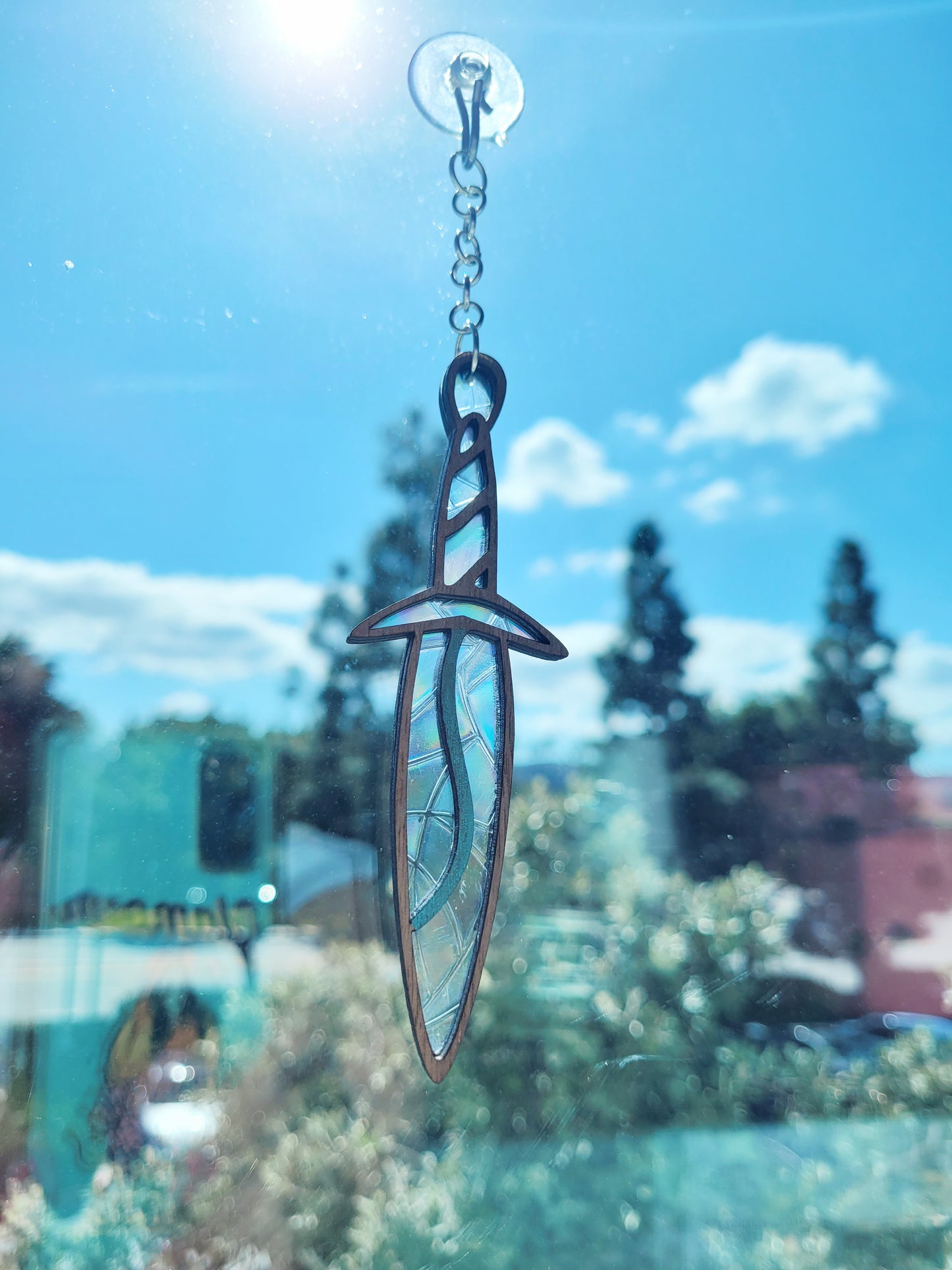 close up of sting suncatcher in window.