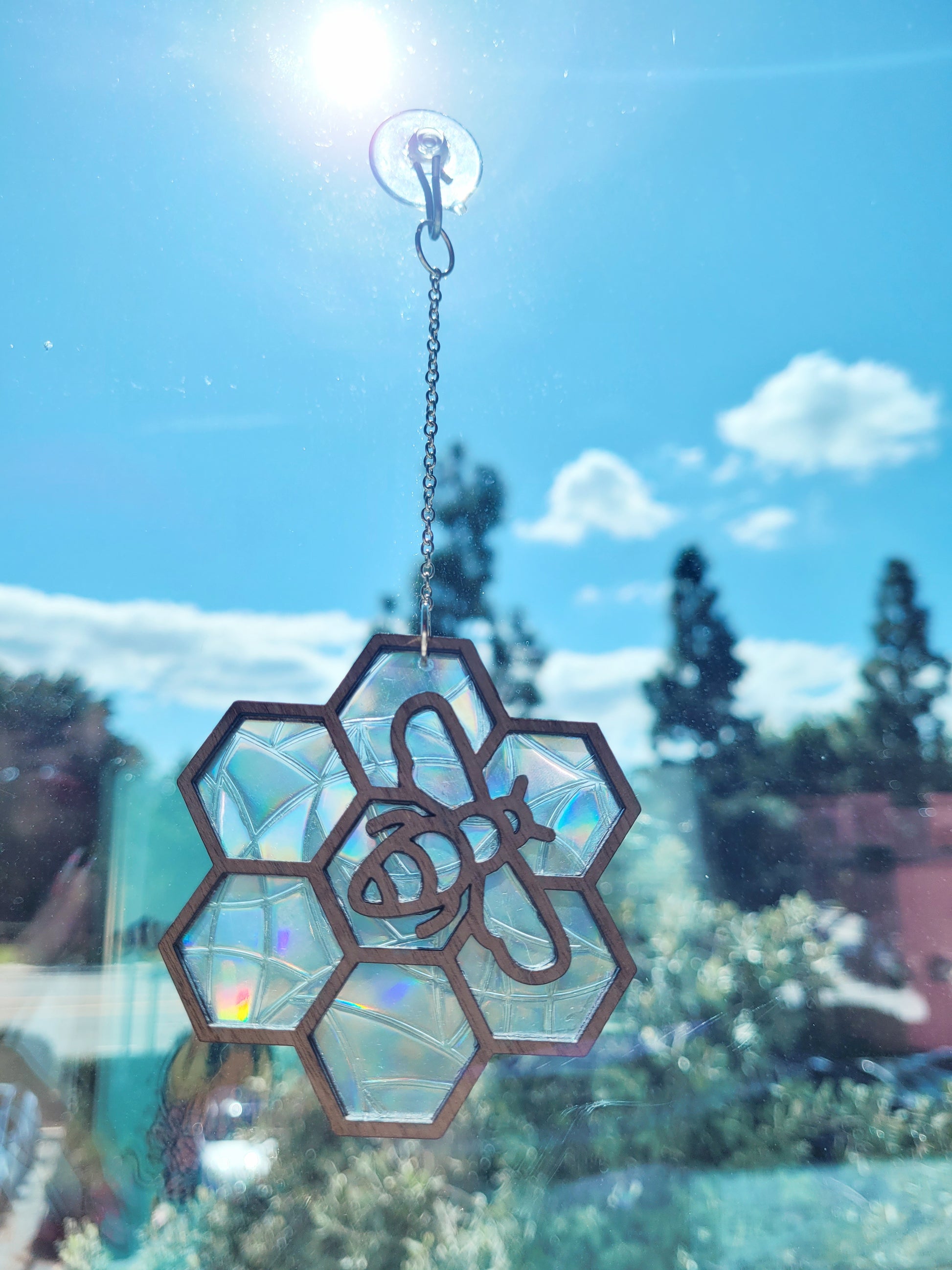 close up of bee suncatcher in a window