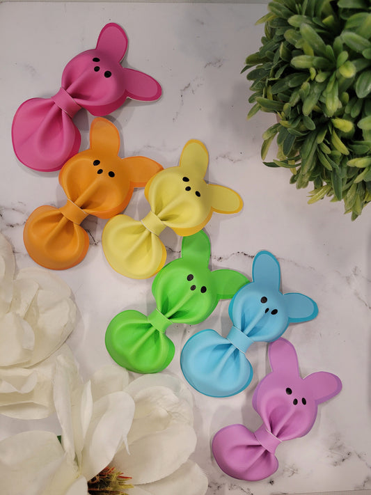 6 colors of bunny hair clips on a marble background