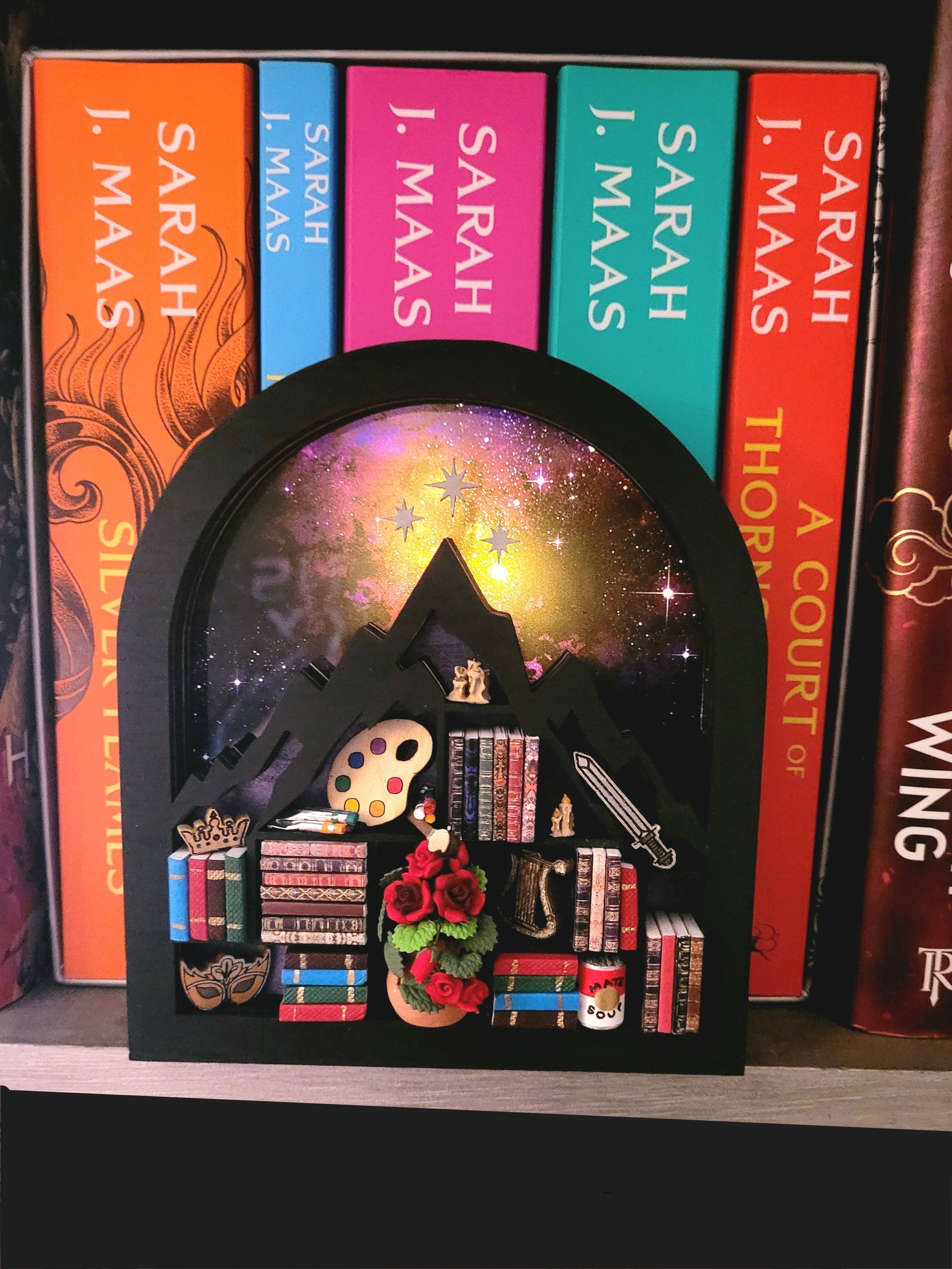 ACOTAR mini bookcase lit up in front of books