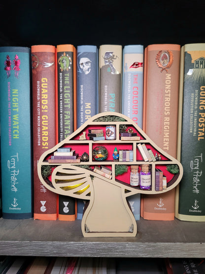 Lit Mushroom Mini Bookshelf on a bookcase in front of books