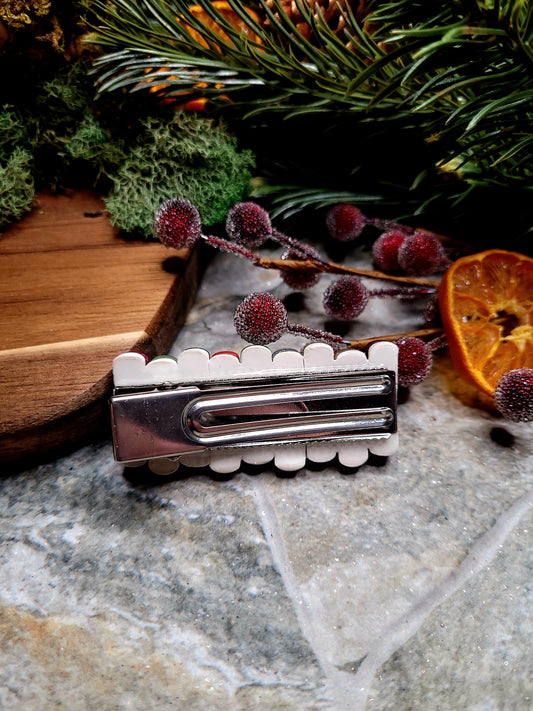 Back of bookstack clip on a wood and stone background surrounded by moss and foliage