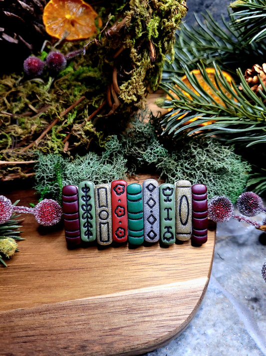 Bookstack clip on a wood and stone background surrounded by moss