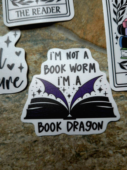 Book Dragon sticker on a stone background 