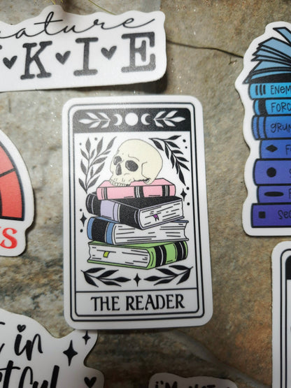 the reader tarot sticker on stone background 
