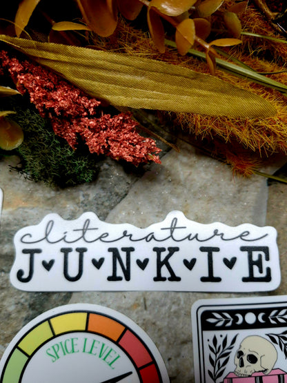 cliterature junkie sticker on a stone background 