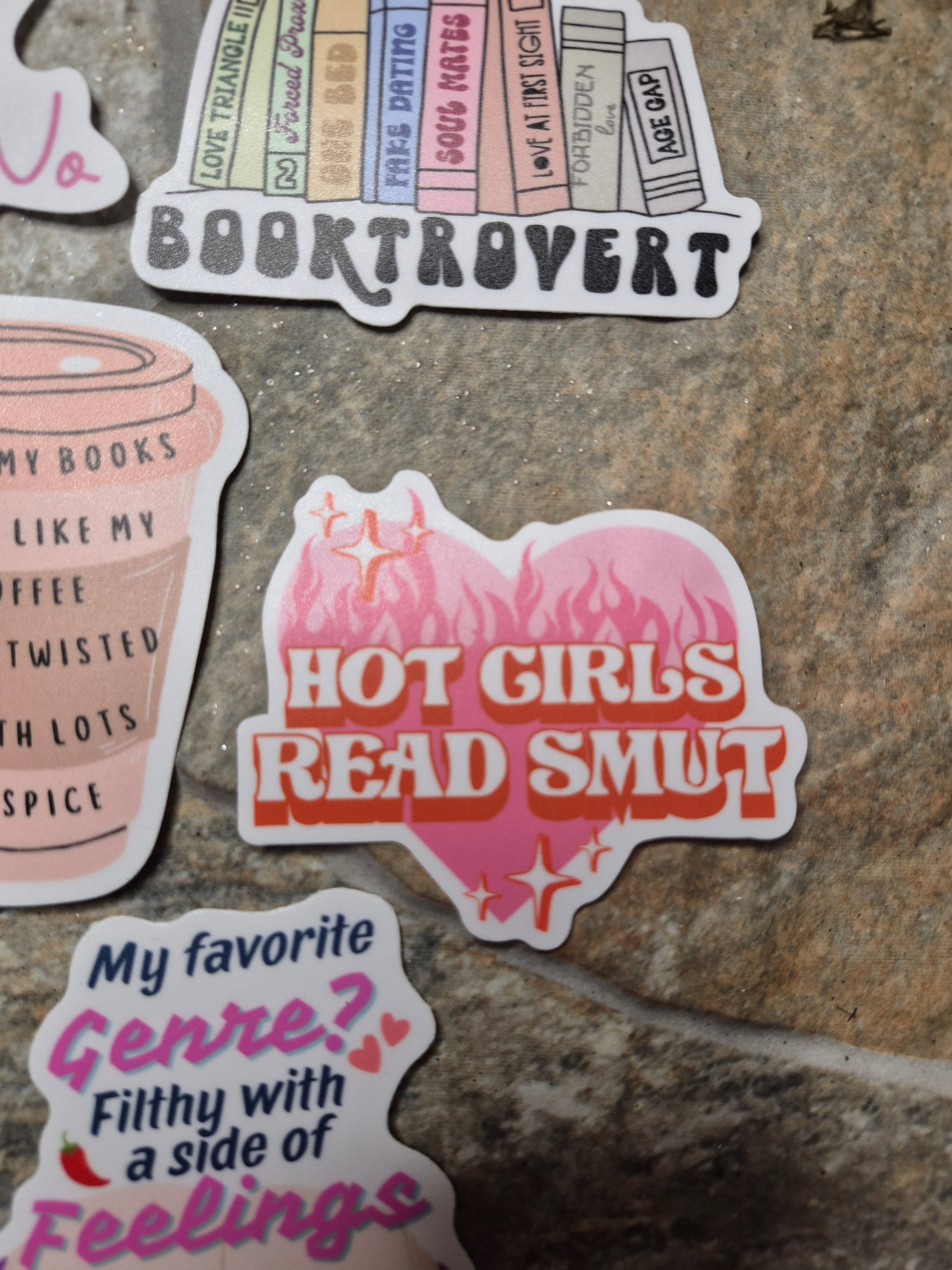 hot girls read smut sticker on a stone background 