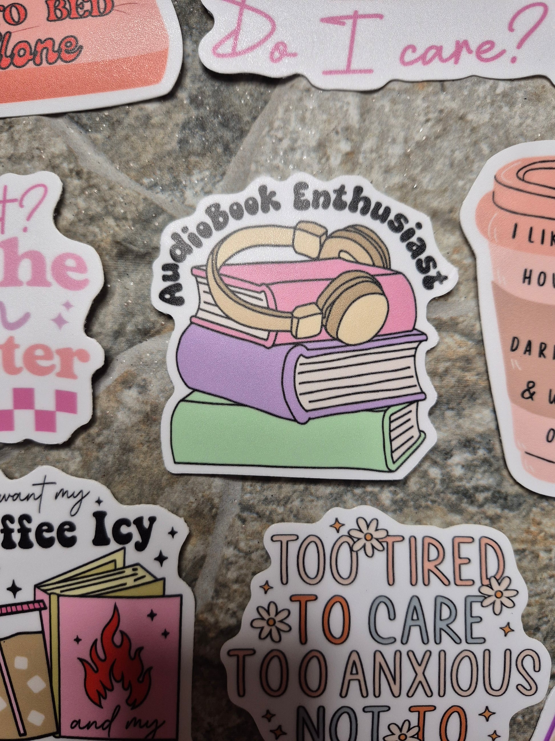 audiobook enthusiast sticker on a stone background. 
