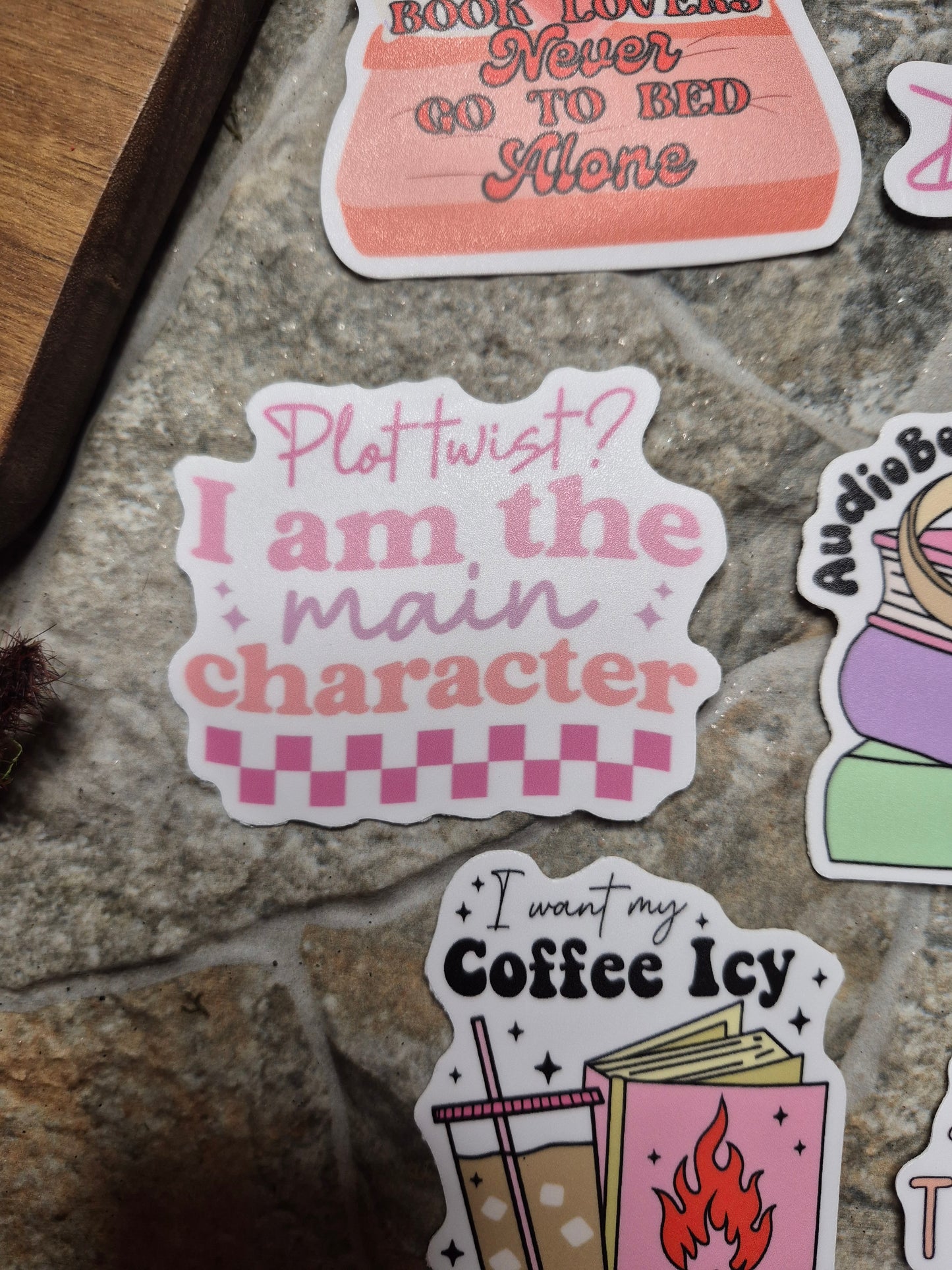 plot twist sticker on a stone background 