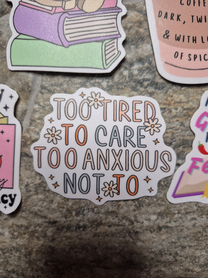 too tired to care sticker on a stone background 
