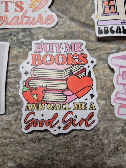 buy me books sticker on stone background 