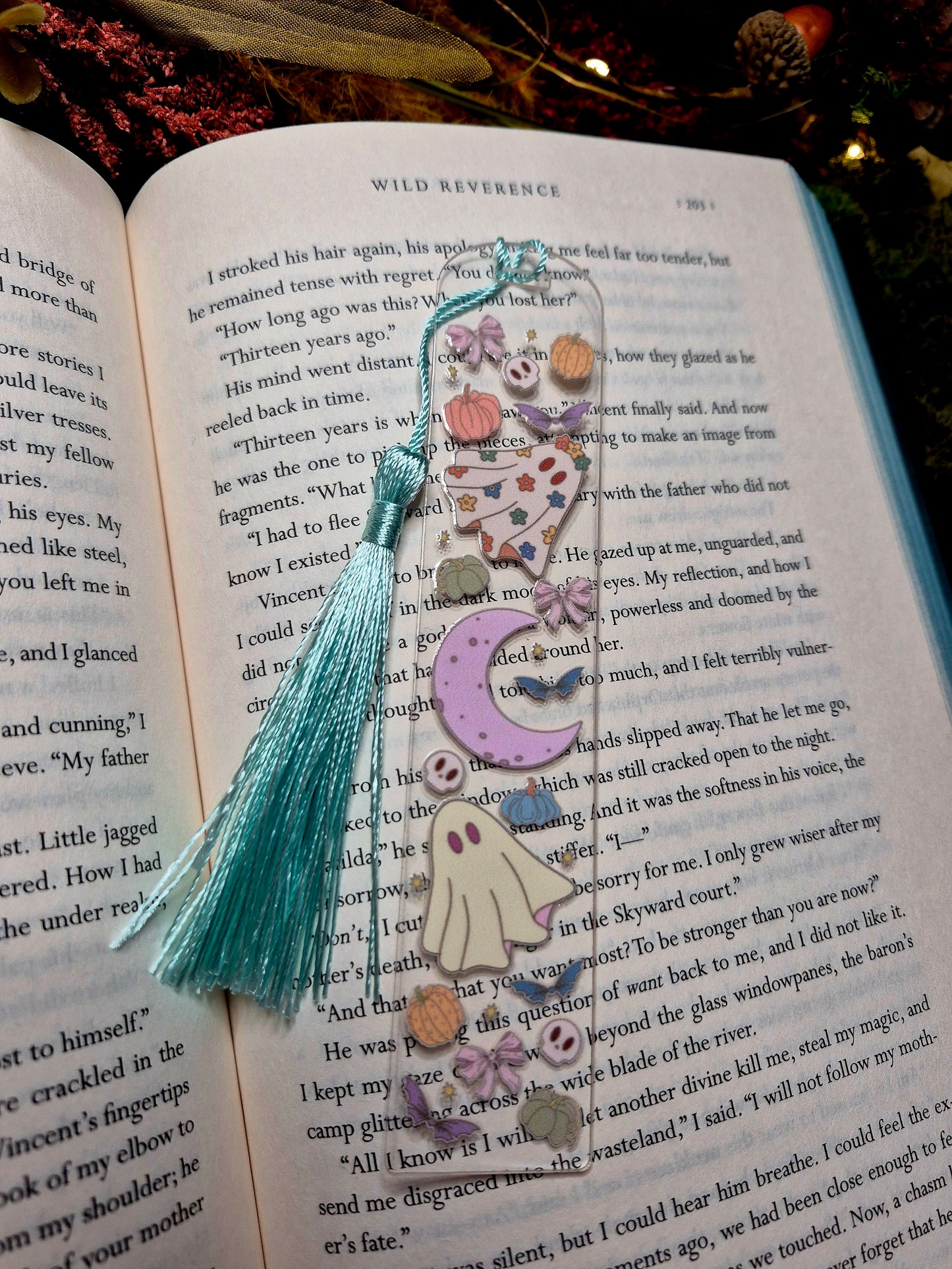 Ghostie bookmark on a book background. 