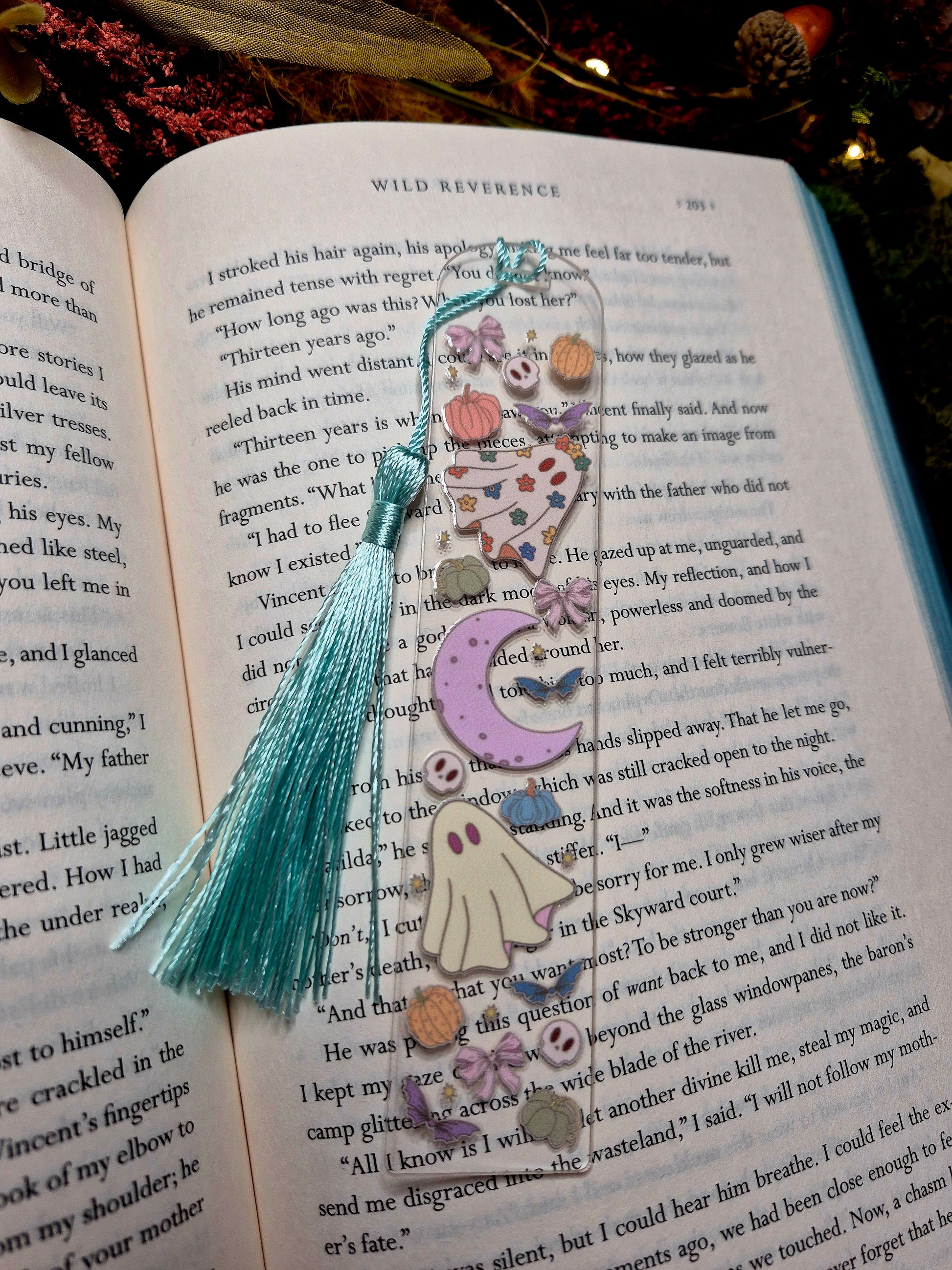 Ghostie bookmark on a book background. 