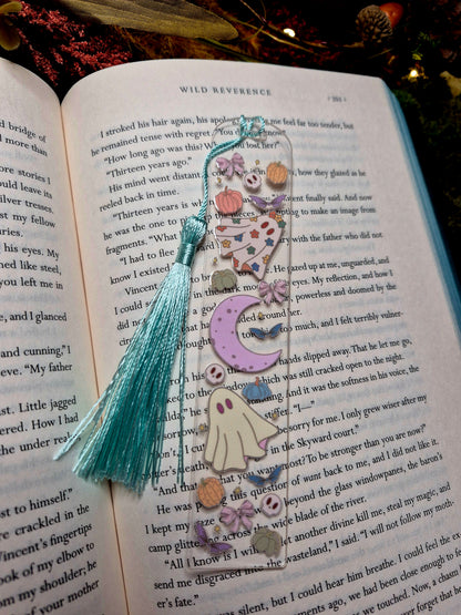 Ghostie bookmark on a book background. 