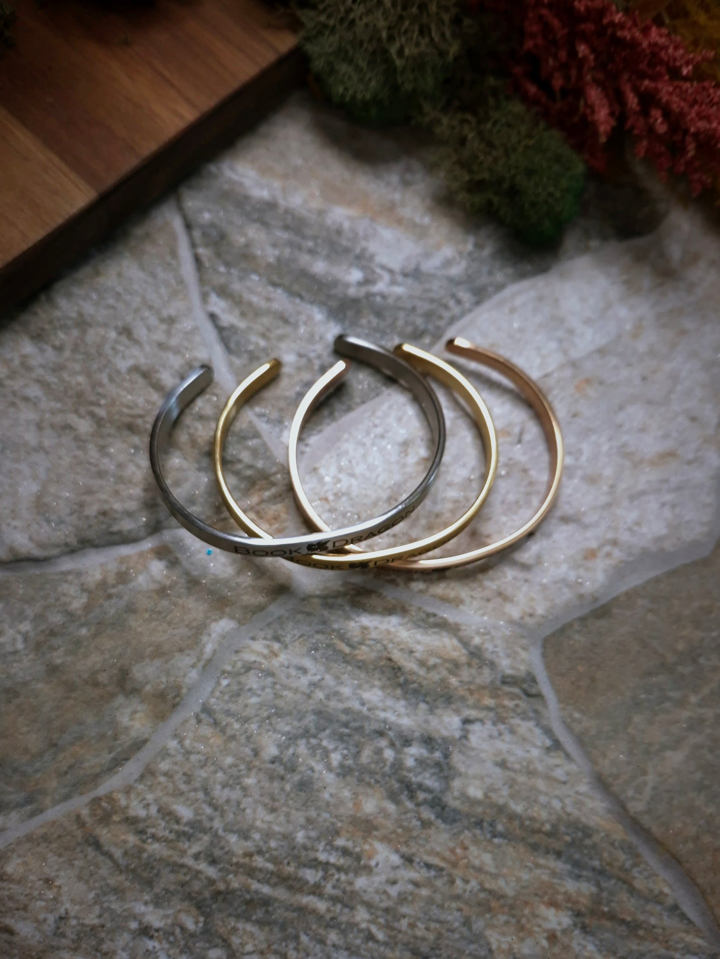 side view of adjustable bracelets on a stone background. 