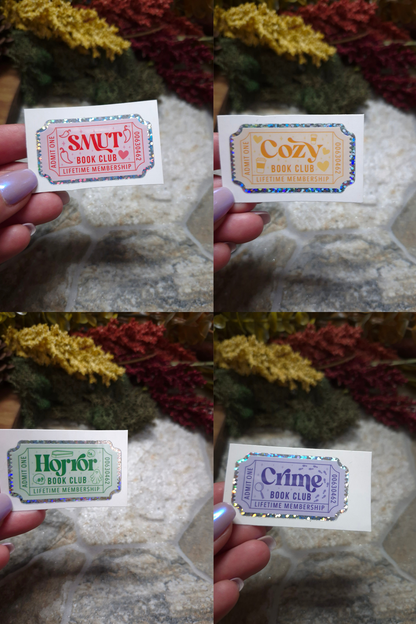 Smut, Cozy, Horror, Crime Book Genre Stickers on a stone background