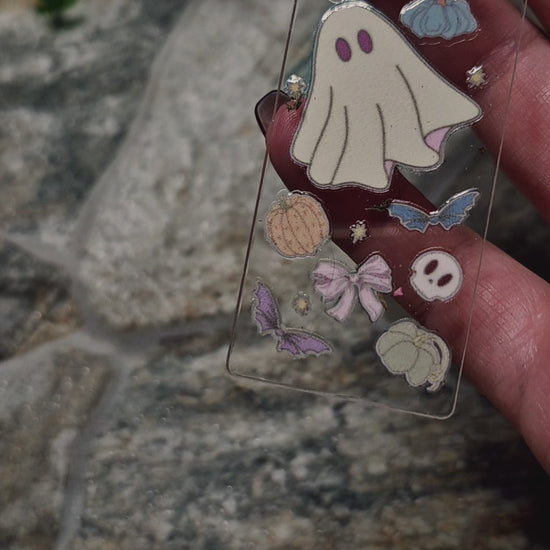 video of ghostie bookmark on a stone background 