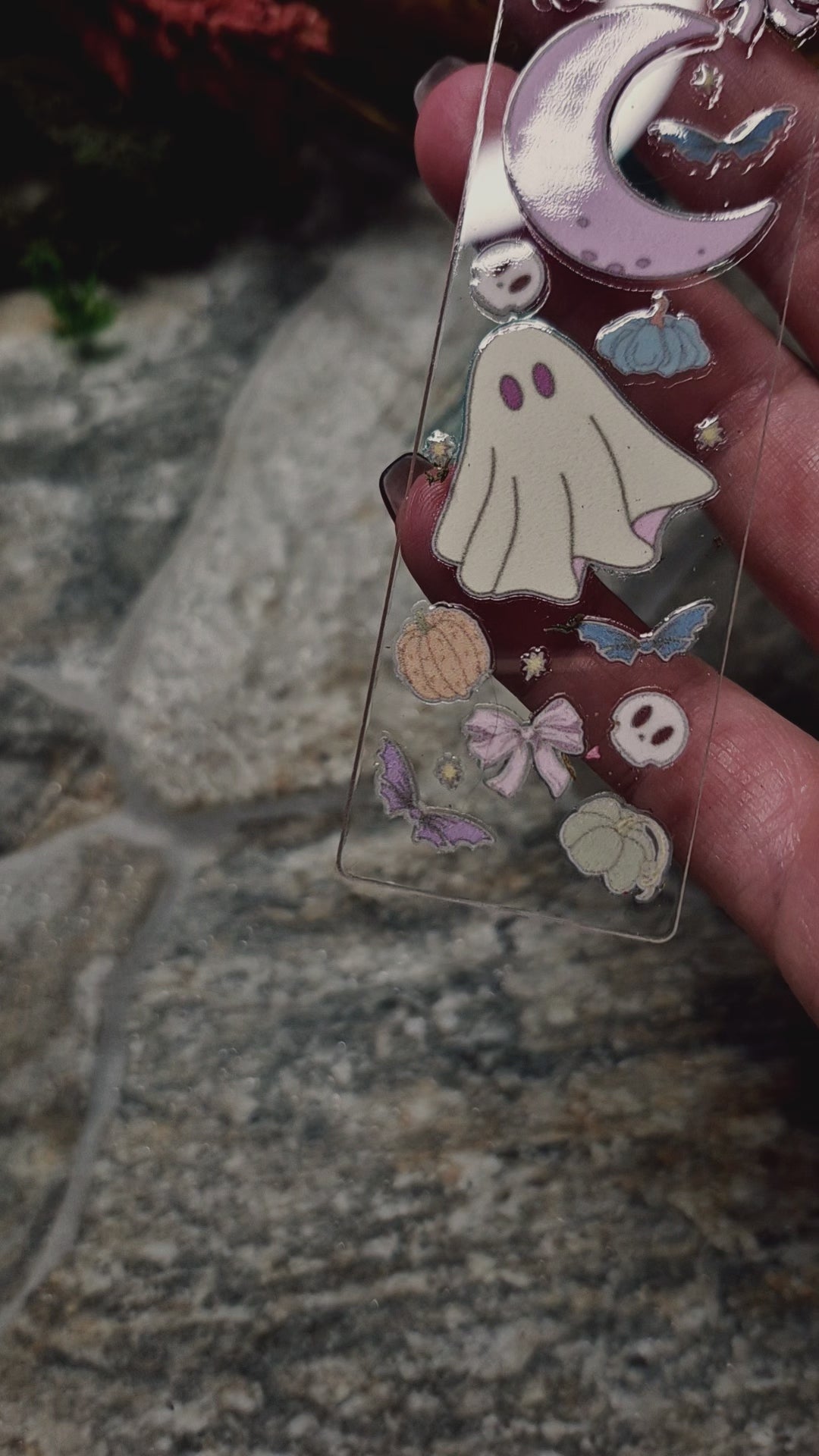 video of ghostie bookmark on a stone background 