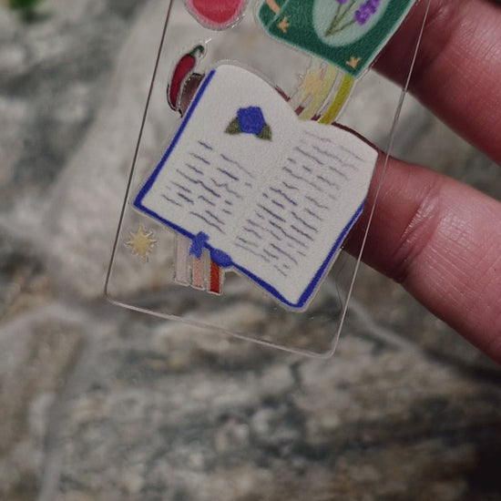 video of romantasy bookmark on a stone background