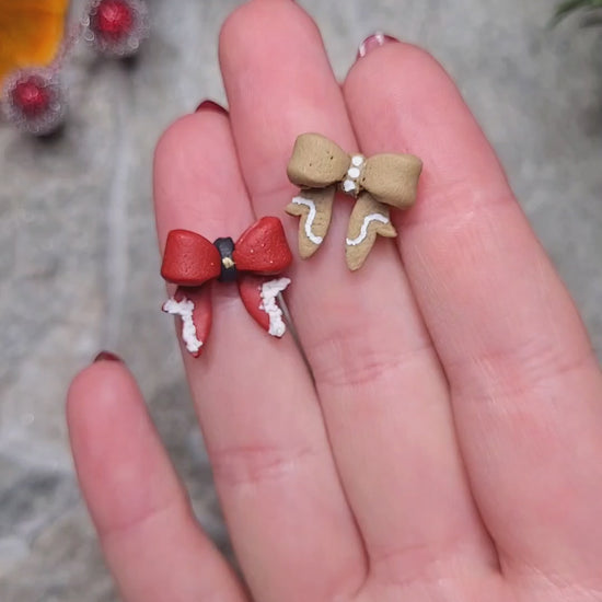 Video close up on Christmas Bow studs on a stone background surrounded by foliage