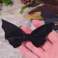 Video close up of Bat bows on stone background surrounded by foliage 