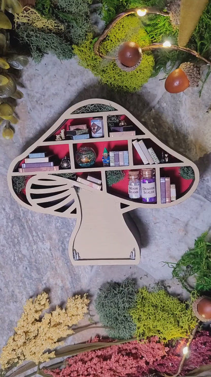 video of Lighting Mushroom Mini Bookshelf on a stone background surrounded by foliage. 
