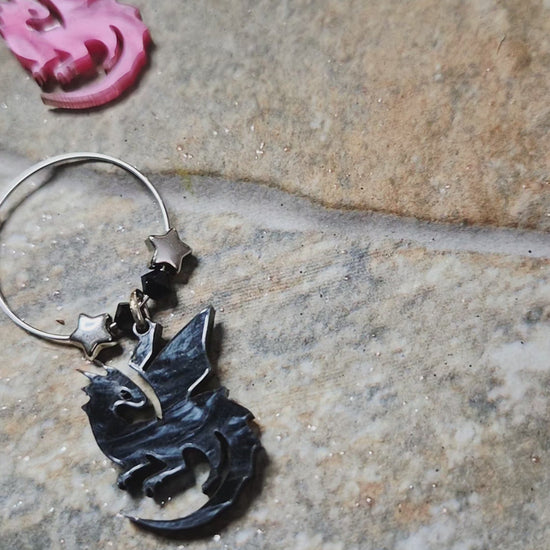 video of dragon wine charms on a stone surface