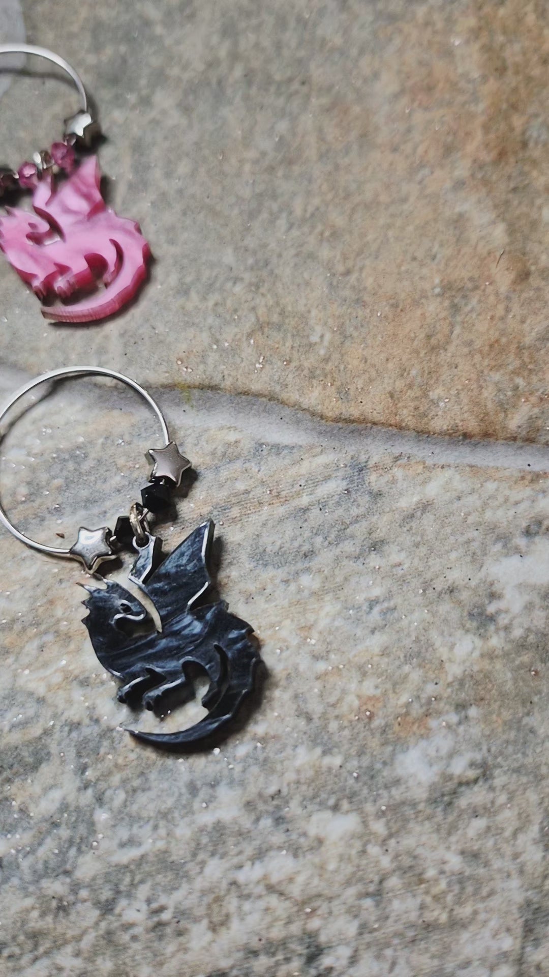 video of dragon wine charms on a stone surface