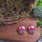 video close up of toadstool studs on wood and stone background surrounded by moss. 