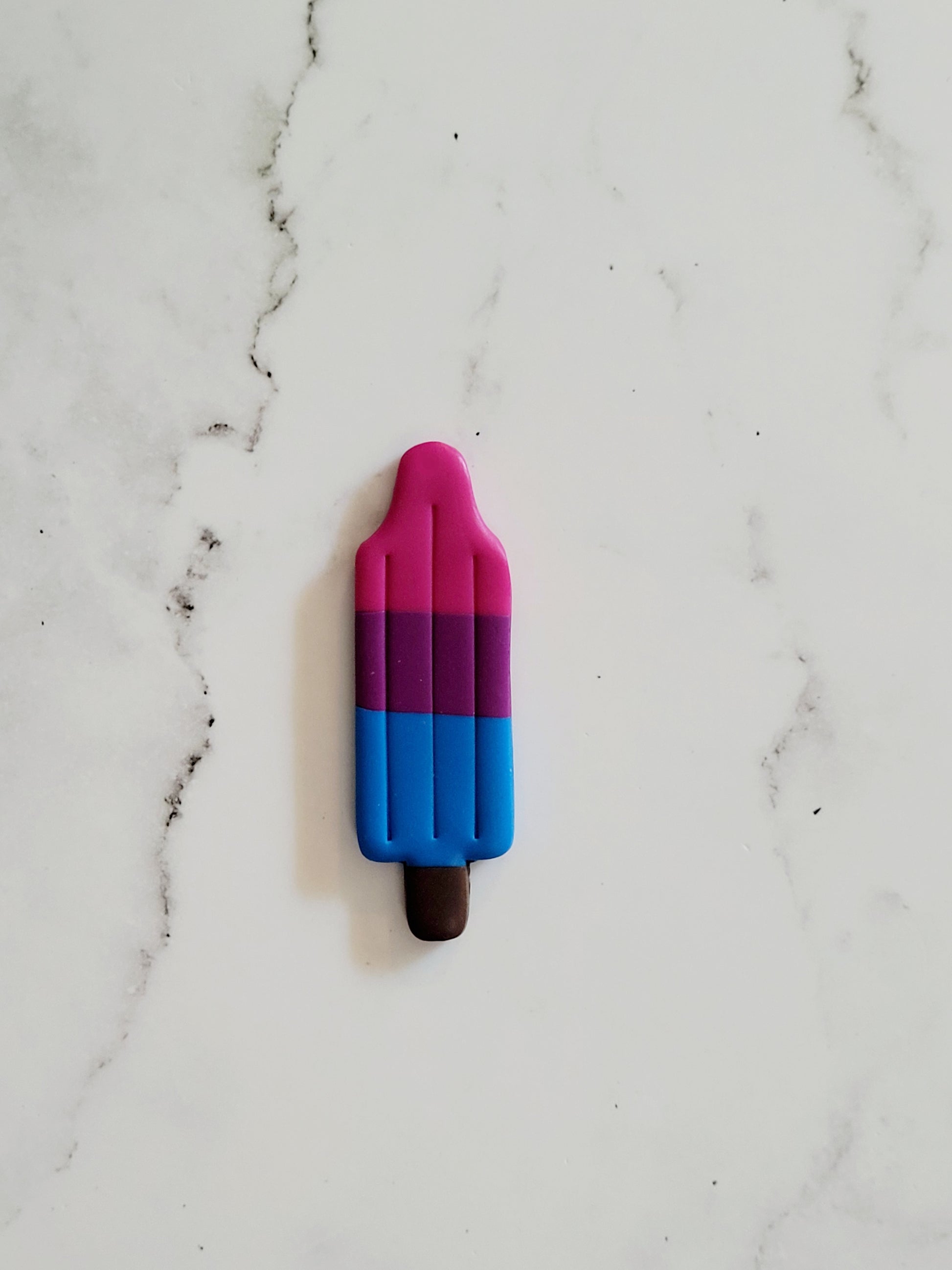 Closeup of the Bi Pride Flag Bomb Pop Pin