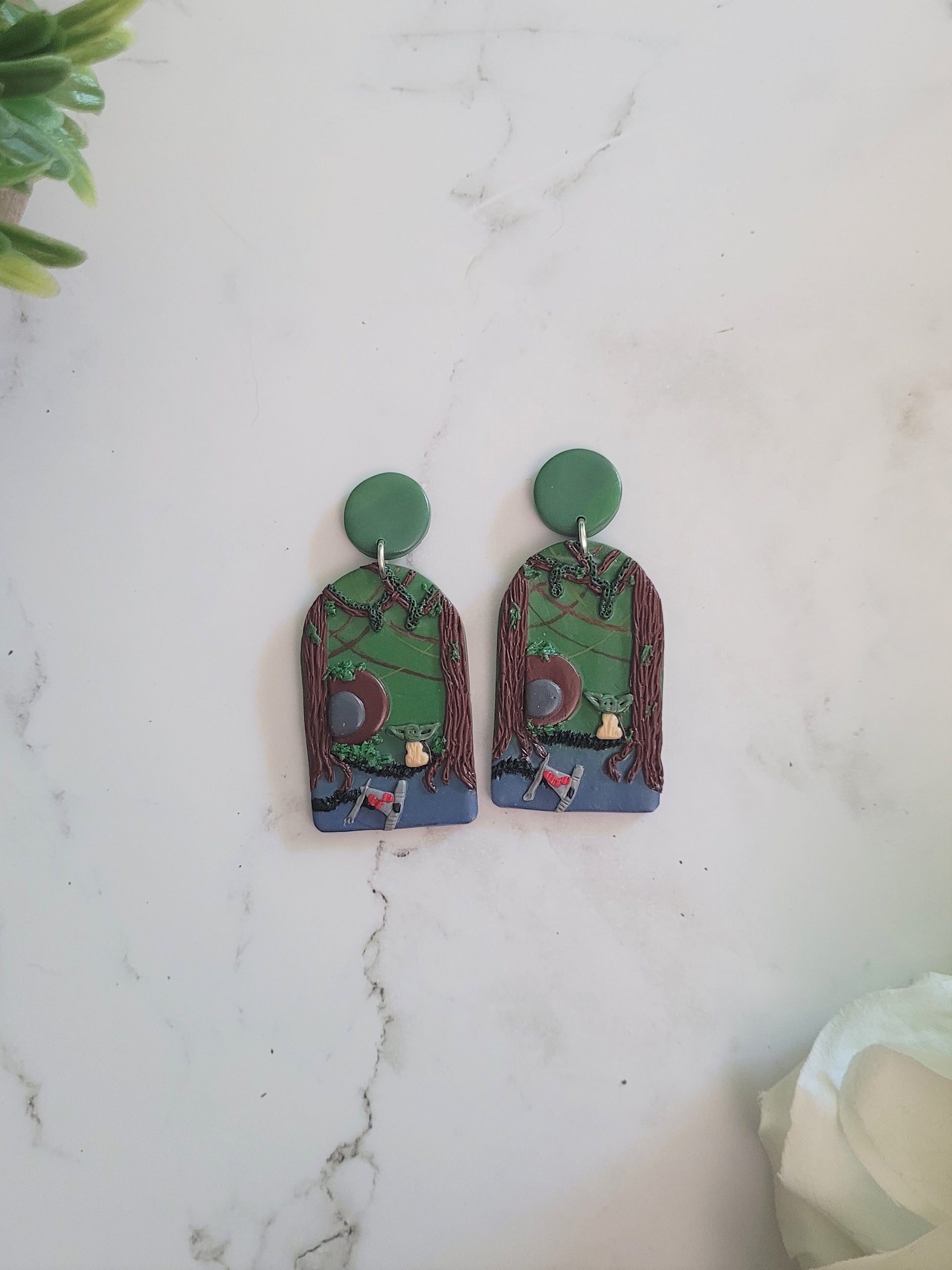 Arch earrings with a swamp landscape