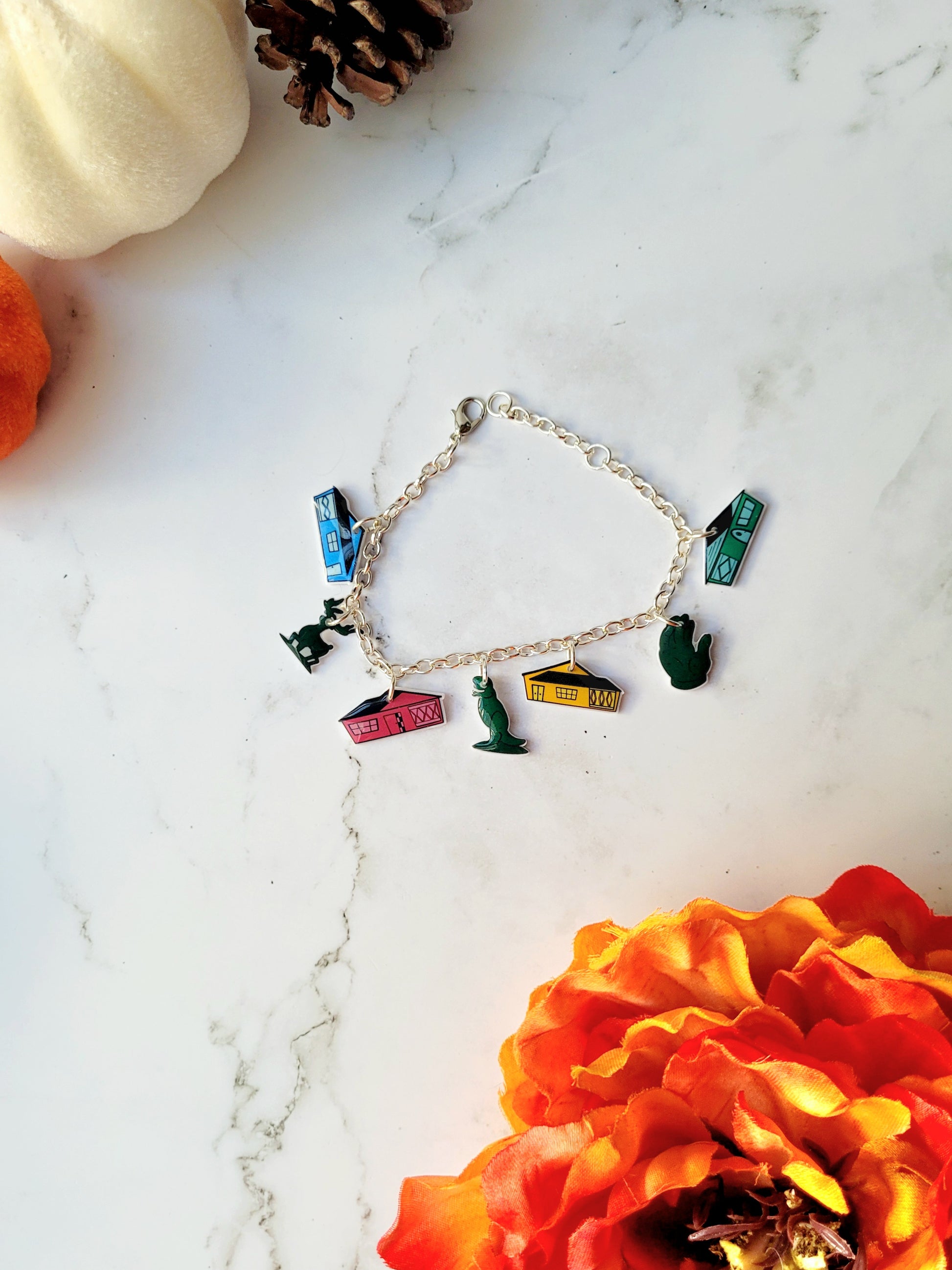Edward Scissorhands themed charm bracelet on a marble background.  