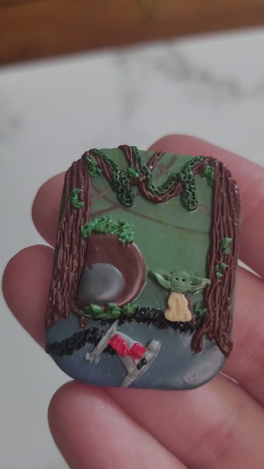 close up of rectangle Brooch with a swamp landscape